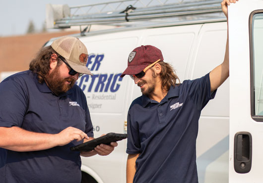 Scott Pence (left) and Jerry Cantrall review project details.